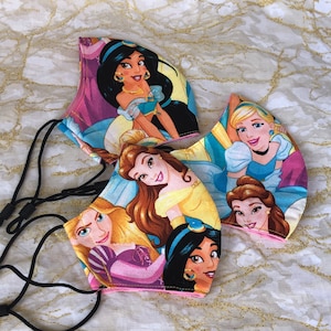 Disney Princess Adjustable Fabric Face Mask, Washable and Reusable Face Covering, Kids Allergy Dust Mask