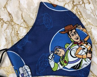 Toy Story Woody and Buzz Fully Adjustable Fabric Face Mask, Washable and Reusable Face Covering, Kids Allergy Dust Mask
