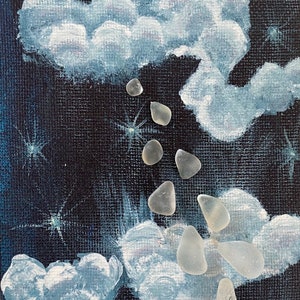 May include: A painting of a night sky with white clouds and a trail of white sea glass falling from the clouds.
