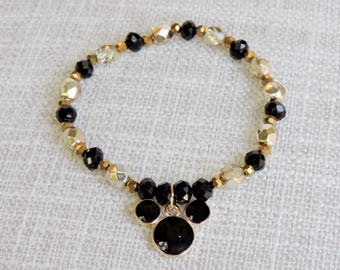 Pulsera de cuentas negras y doradas inspirada en Mickey Mouse