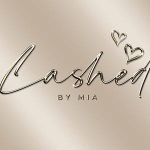 May include: A gold script logo with the text "Lashed by Mia" and two gold hearts above the text.