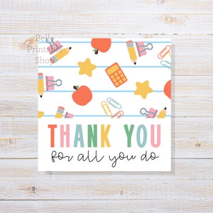 May include: A printable thank you card with a white background and a colorful pattern of school supplies, including apples, stars, pencils, calculators, and paper clips. The text "THANK YOU for all you do" is written in rainbow colors.