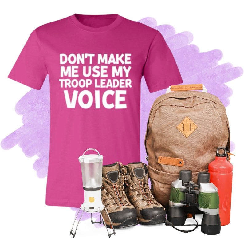 May include: Pink t-shirt with the text "Don't make me use my troop leader voice".  A brown backpack, a pair of brown hiking boots, a lantern, binoculars, and a red water bottle.