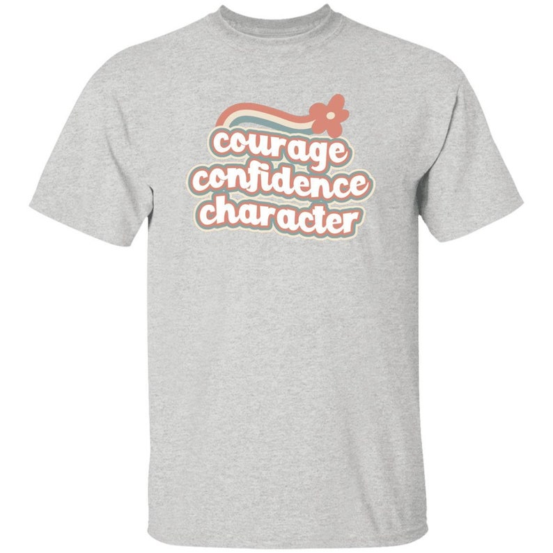 Camiseta arcoíris retro con el personaje "JÓVENES, Coraje y Confianza" en tallas infantiles para Girl Scouts Ash