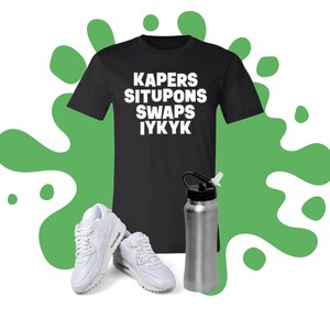 May include: Black t-shirt with white text that reads "KAPERs SITUPONs SWAPs IYKYK".  A pair of white sneakers and a silver water bottle are also pictured.