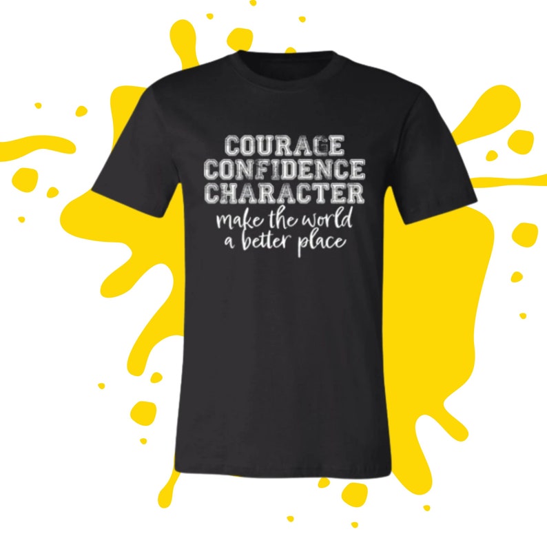 May include: Black t-shirt with white text that reads "COURAGE CONFIDENCE CHARACTER make the world a better place"