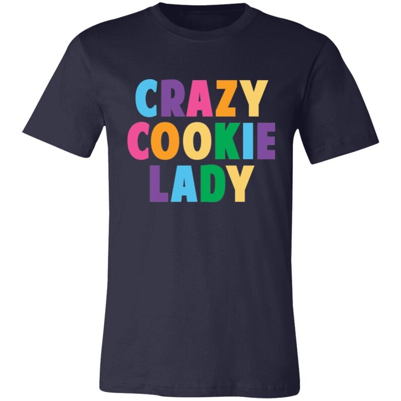 May include: Navy blue t-shirt with the text "CRAZY COOKIE LADY" in rainbow colours.