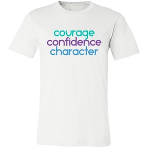May include: White t-shirt with the words "courage", "confidence", and "character" printed in teal, purple, and blue.
