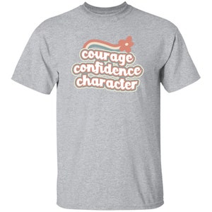 Camiseta arcoíris retro con el personaje "JÓVENES, Coraje y Confianza" en tallas infantiles para Girl Scouts Sport Grey