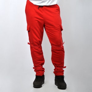 Red pants with cargo pockets and ribbons on velcro