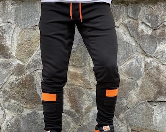 Street fashion joggers pants with cuffs and pockets, nice sweatpants with orange patch