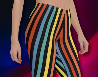 Puede incluir: Leggins negros con rayas diagonales de colores en naranja, amarillo, azul y verde.