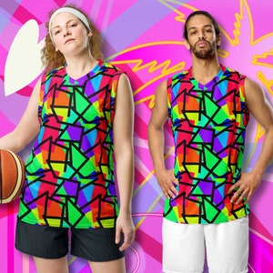 May include: Two basketball jerseys with a geometric pattern in bright colors, including red, orange, yellow, green, blue, and purple. The jerseys have a black outline and a V-neck.