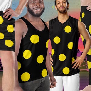 May include: Black athletic shorts, tank top, and sleeveless shirt, and leggings, all featuring a repeating pattern of large yellow polka dots. The clothing is shown on multiple people.