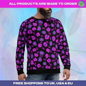 Harajuku pink leopard skin sweatshirt with black background. Popping 80s glam rock sweater in retro style pink and blue leopardskin sublimation print. Festival pullover fashion, streetwear athleisurewear.