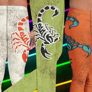May include: Leggings with scorpion designs in three different color schemes. One pair is off-white with a red scorpion, another is green with a black and white scorpion, and the third is orange with a teal scorpion. All have a dotted pattern.