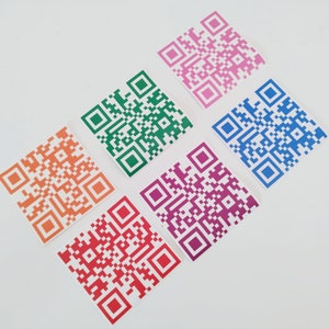 May include: Six square stickers with different coloured QR codes. The colours are pink, green, blue, purple, orange, and red.
