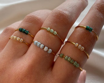 Simple gold anxiety rings with colored glass beads