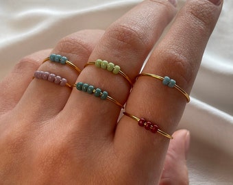 Simple gold anxiety rings with colorful glass beads