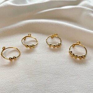 Einfache goldene Anxiety Ringe mit gold Kugeln Bild 7