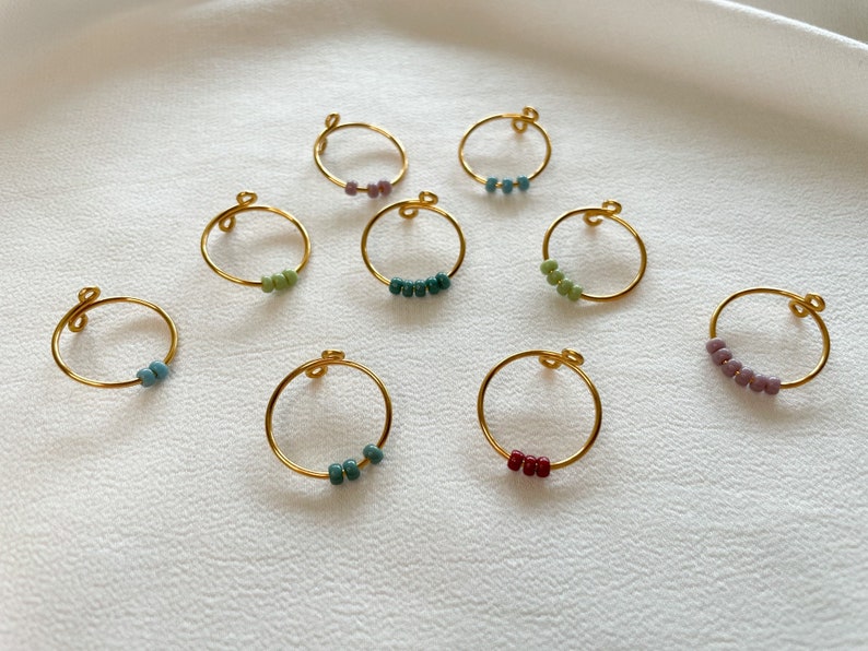 Simple golden anxiety rings with colorful glass beads image 7