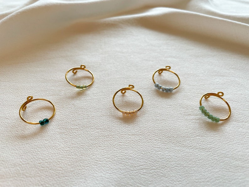 Simple golden anxiety rings with colored glass beads image 7