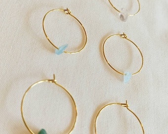 3 pairs of simple gold hoop earrings with various gemstones aquamarine prase rock crystal