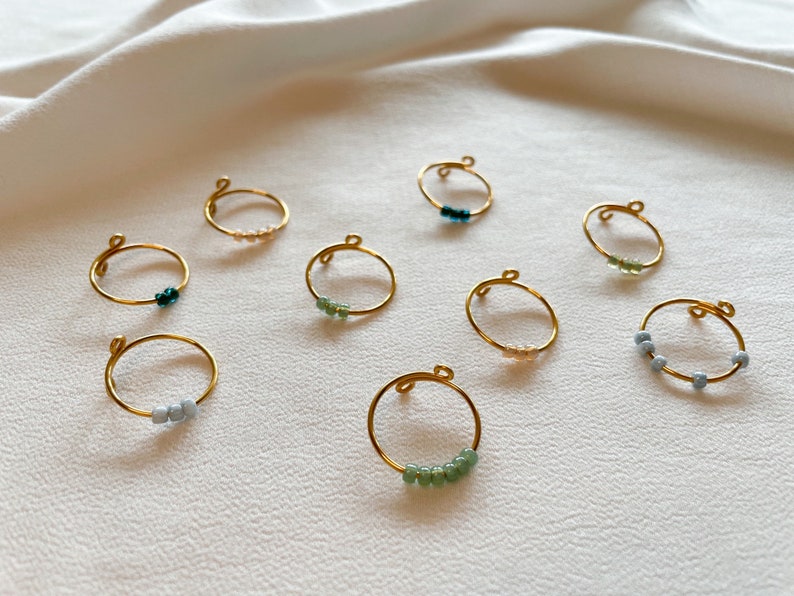 Simple golden anxiety rings with colored glass beads image 8