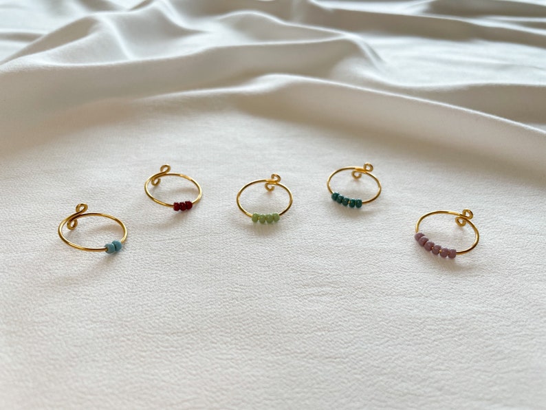 Simple golden anxiety rings with colorful glass beads image 8