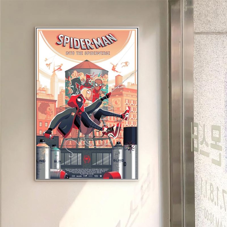 May include: A framed poster for Spider-Man: Into the Spider-Verse. The illustration shows Spider-Man in action against a city skyline, with spray paint cans in the foreground and the film's title prominently displayed.