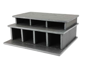 May include: A two-tiered slate organizer with six compartments on each level. The organizer is made of natural slate and has a rustic, gray finish.