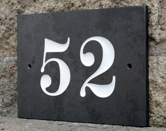 May include: Black slate house number plaque with white painted numbers "52".