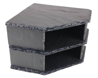 May include: A three-tiered corner shelf made of black slate. Each shelf has a cutout for easy access.