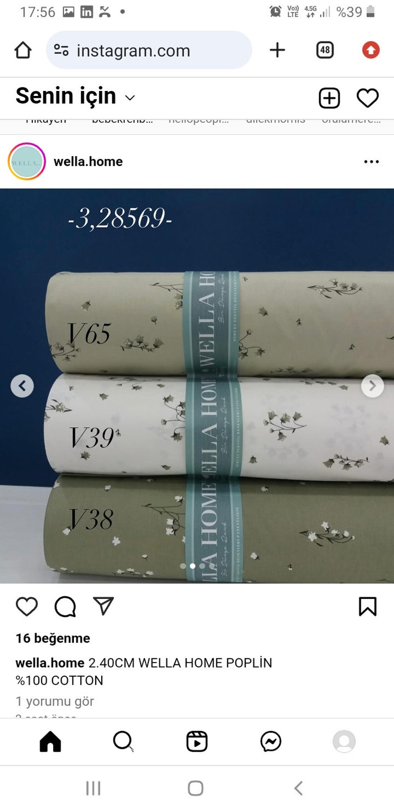 May include: Three rolls of fabric with a floral pattern. The fabric is white, light green, and dark green. The fabric is labeled "Wella Home Poplin" and is 100% cotton.