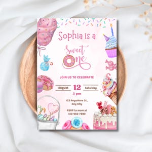 May include: A pink invitation with watercolor illustrations of sweets, including a cupcake, ice cream cone, and donut. The text reads "Sophia is a Sweet One" with event details: August 12, 3 pm, and an RSVP number.