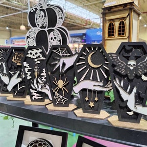 Coffin display art. Alternative goth death moth decor. Halloween. Black and gold edition