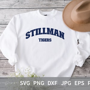 May include: White sweatshirt with a navy blue arched design that says "Stillman Tigers".