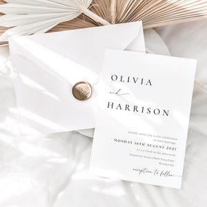 May include: A white wedding invitation with a gold wax seal. The invitation reads "Olivia and Harrison" and includes the date "Monday 16th August 2027" and the time "at 3 o'clock in the afternoon".