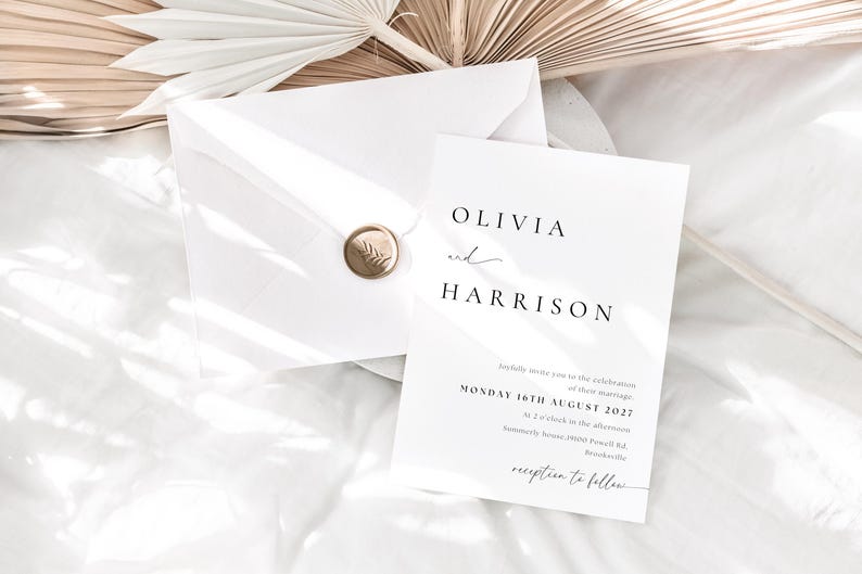 May include: A white wedding invitation with a gold wax seal. The invitation reads "Olivia and Harrison" and includes the date "Monday 16th August 2027" and the time "at 3 o'clock in the afternoon".