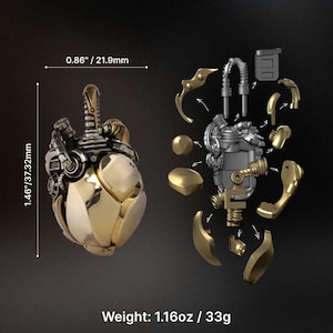 May include: A mechanical heart pendant with gold and silver metallic finishes, shown assembled and as individual components. The assembled piece measures 0.86 inches by 1.46 inches and has a total weight of 1.16 ounces. The design features intricate pipes, gears, and plates.