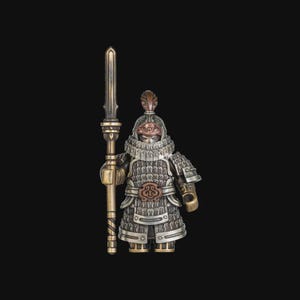 May include: A detailed figurine of a warrior in ornate armor, holding a spear. The figure is primarily silver and bronze, with intricate detailing on the helmet, armor, and weapon. The background is solid black.