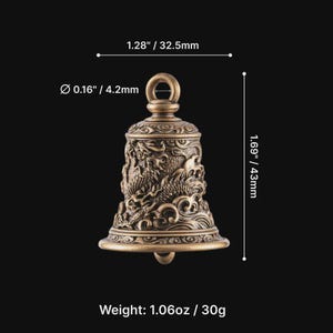 May include: Bronze-colored bell with intricate dragon and wave designs. The bell is 1.69 inches (43mm) tall and 1.28 inches (32.5mm) wide. It weighs 1.06 ounces (30g). The bell has a loop at the top for hanging.