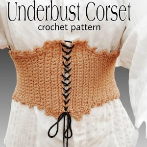 May include: A crocheted underbust corset with a black lace-up front. The corset is a light brown color and has a scalloped edge.