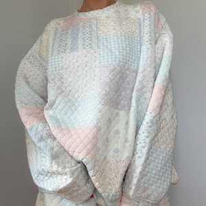 Nyanser av blå quiltad pastellfärgad tröja