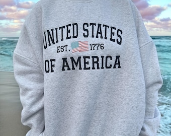 Sudadera gris perla con bandera bordada de los Estados Unidos de América