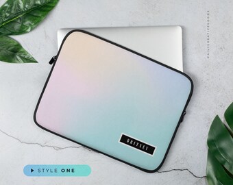 May include: A pastel blue, pink, and yellow laptop sleeve with a black zipper and a black label that says "BRITNEY".