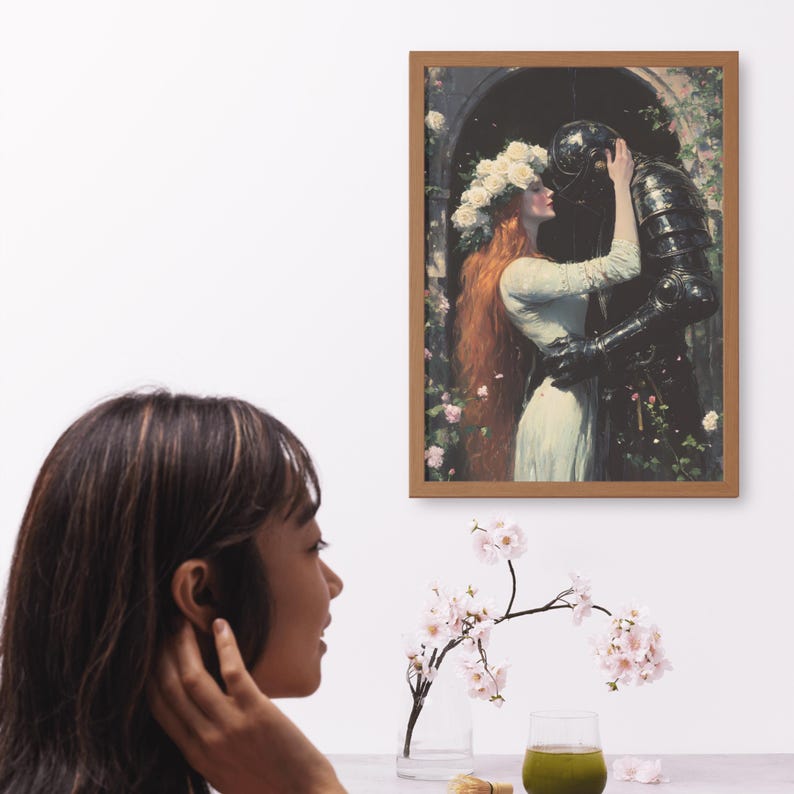 May include: A framed painting of a woman in a white dress with a crown of white flowers on her head, embracing a knight in black armor. The painting is set against a backdrop of a garden with green foliage and pink flowers.