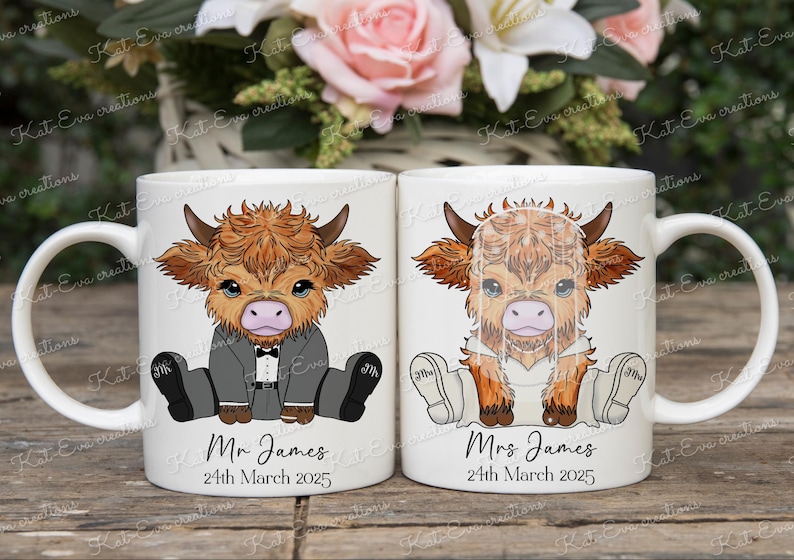 May include: Two white ceramic mugs with handles. Each mug features a cartoon illustration of a Highland cow wearing a wedding outfit. One mug says "Mr. James" and the other says "Mrs. James". Both mugs have the date "24th March 2025" printed below the name.
