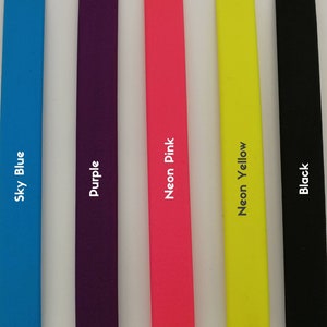 May include: Five coloured strips are displayed, each with its name printed in white. The colours are sky blue, purple, neon pink, neon yellow, and black, arranged from left to right.