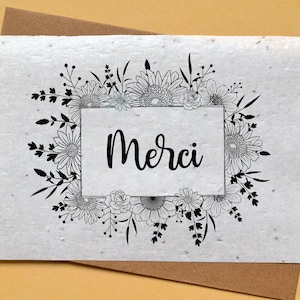 Carte à planter Merci Nouir et Blanc. Carte ensemencée Merci. Carte fleurs sauvages.